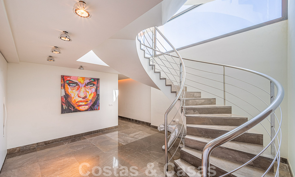 Luxury villa in contemporary architectural style for sale with sea views, located in a desirable residential area on Marbella's Golden Mile 50208