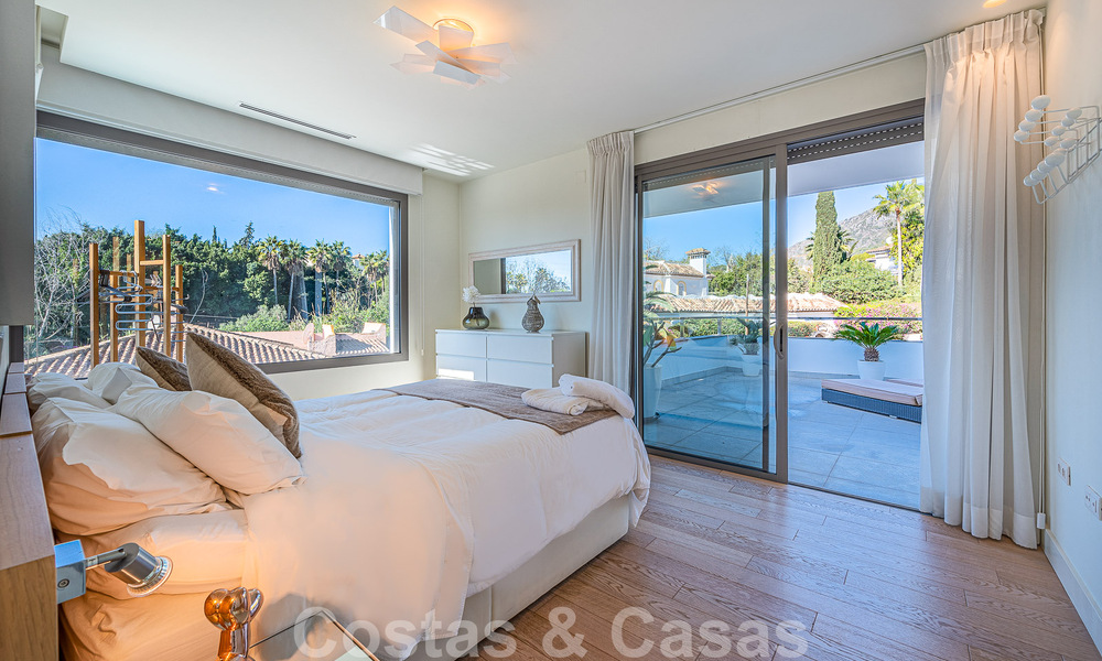 Luxury villa in contemporary architectural style for sale with sea views, located in a desirable residential area on Marbella's Golden Mile 50213