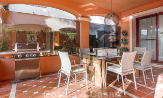 Semi-detached Spanish-style house for sale in a prestigious urbanisation within walking distance of Puerto Banus and the beach in Nueva Andalucia, Marbella 49747 