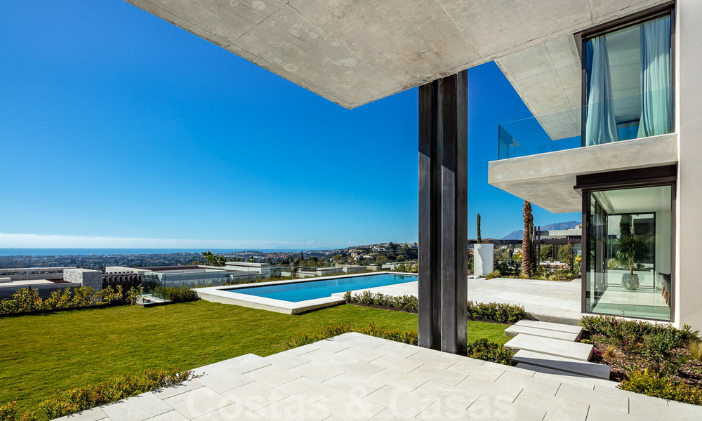 Move-in ready, architectural designer villa for sale with open sea views in a prestigious gated residential area in the hills of La Quinta in Benahavis - Marbella 49250