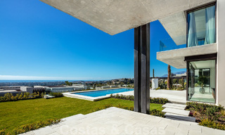 Move-in ready, architectural designer villa for sale with open sea views in a prestigious gated residential area in the hills of La Quinta in Benahavis - Marbella 49250 