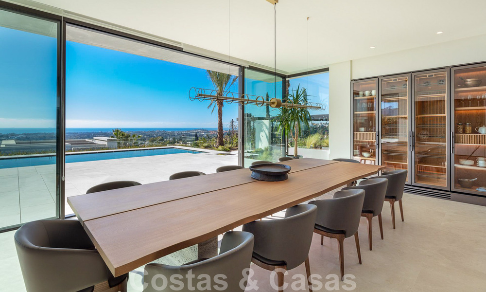 Move-in ready, architectural designer villa for sale with open sea views in a prestigious gated residential area in the hills of La Quinta in Benahavis - Marbella 49251