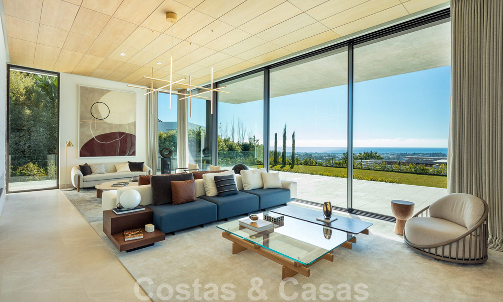 Move-in ready, architectural designer villa for sale with open sea views in a prestigious gated residential area in the hills of La Quinta in Benahavis - Marbella 49253