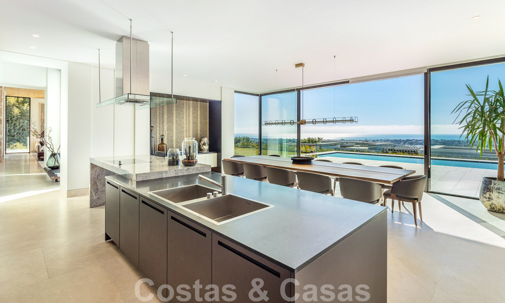 Move-in ready, architectural designer villa for sale with open sea views in a prestigious gated residential area in the hills of La Quinta in Benahavis - Marbella 49256