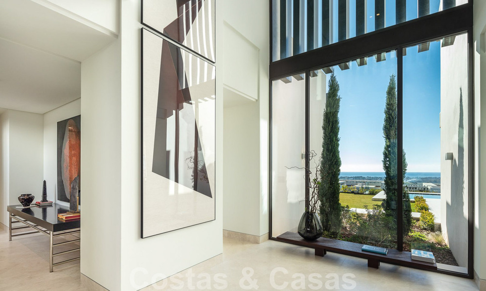 Move-in ready, architectural designer villa for sale with open sea views in a prestigious gated residential area in the hills of La Quinta in Benahavis - Marbella 49260