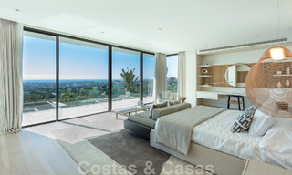 Move-in ready, architectural designer villa for sale with open sea views in a prestigious gated residential area in the hills of La Quinta in Benahavis - Marbella 49264 