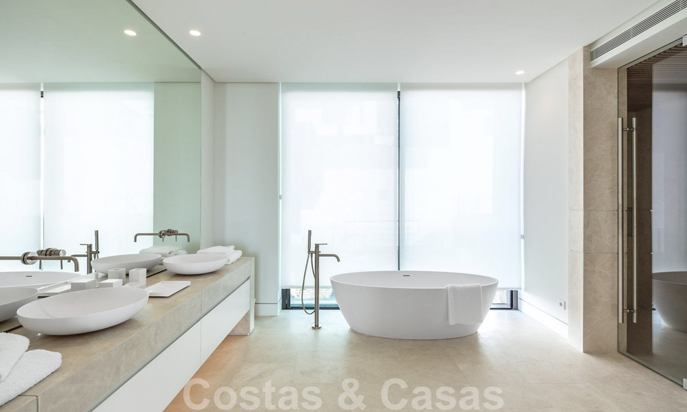 Move-in ready, architectural designer villa for sale with open sea views in a prestigious gated residential area in the hills of La Quinta in Benahavis - Marbella 49265