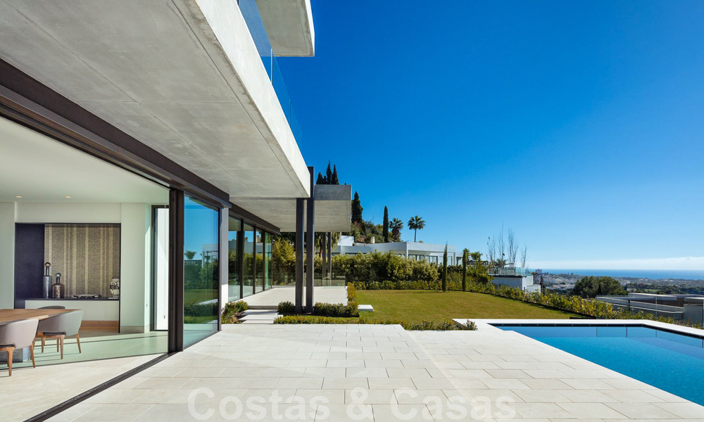 Move-in ready, architectural designer villa for sale with open sea views in a prestigious gated residential area in the hills of La Quinta in Benahavis - Marbella 49280