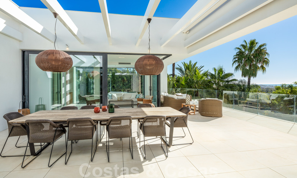 Modern luxury villa for sale located with private tennis court in prestigious residential area in Nueva Andalucia's golf valley, Marbella 50127