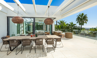 Modern luxury villa for sale located with private tennis court in prestigious residential area in Nueva Andalucia's golf valley, Marbella 50127 