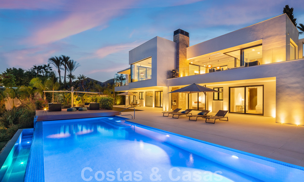 Modern luxury villa for sale located with private tennis court in prestigious residential area in Nueva Andalucia's golf valley, Marbella 50128