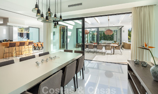 Modern luxury villa for sale located with private tennis court in prestigious residential area in Nueva Andalucia's golf valley, Marbella 50132 