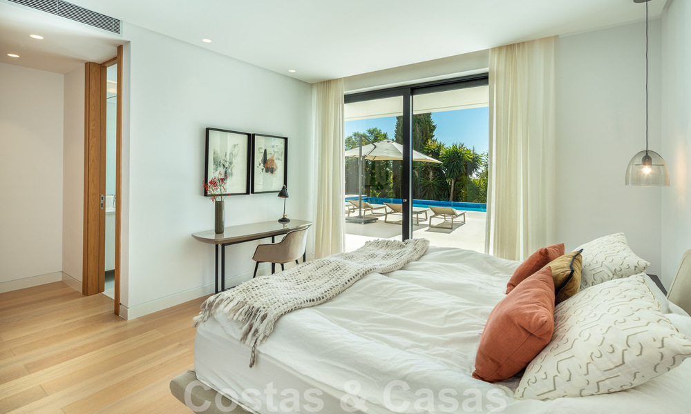 Modern luxury villa for sale located with private tennis court in prestigious residential area in Nueva Andalucia's golf valley, Marbella 50142