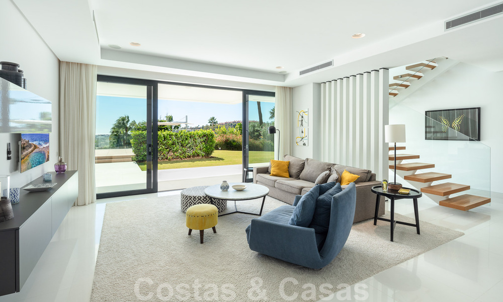 Modern luxury villa for sale located with private tennis court in prestigious residential area in Nueva Andalucia's golf valley, Marbella 50145