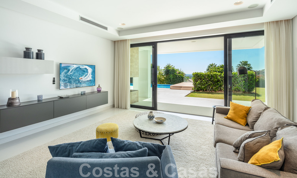 Modern luxury villa for sale located with private tennis court in prestigious residential area in Nueva Andalucia's golf valley, Marbella 50146