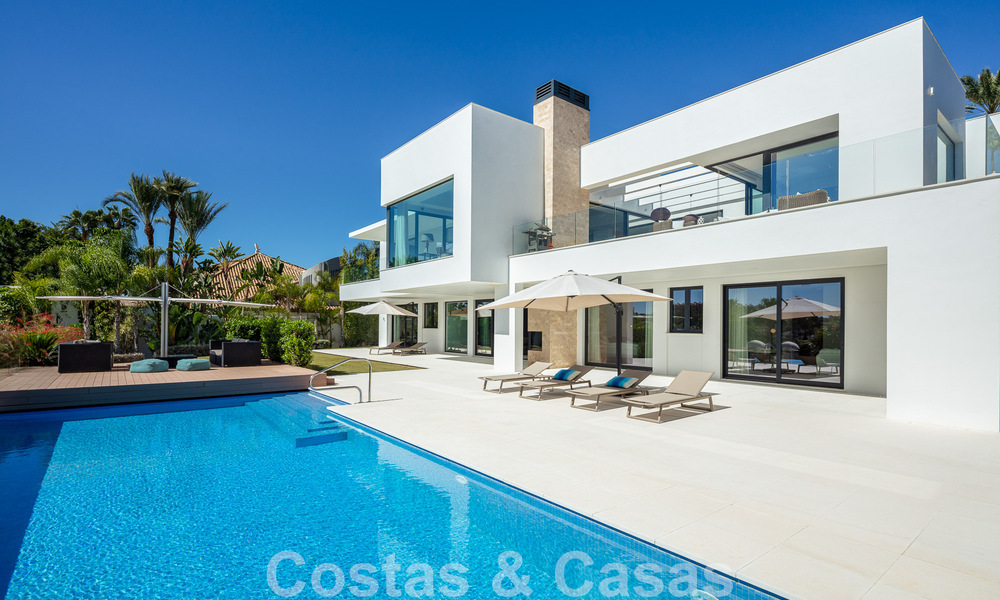 Modern luxury villa for sale located with private tennis court in prestigious residential area in Nueva Andalucia's golf valley, Marbella 50148