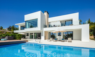 Modern luxury villa for sale located with private tennis court in prestigious residential area in Nueva Andalucia's golf valley, Marbella 50149 