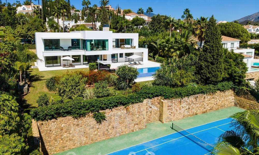 Modern luxury villa for sale located with private tennis court in prestigious residential area in Nueva Andalucia's golf valley, Marbella 50150
