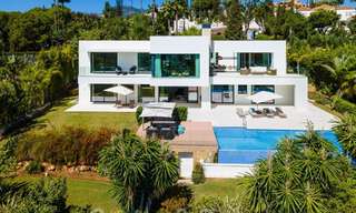 Modern luxury villa for sale located with private tennis court in prestigious residential area in Nueva Andalucia's golf valley, Marbella 50152 