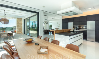 Modern luxury villa for sale located with private tennis court in prestigious residential area in Nueva Andalucia's golf valley, Marbella 50153 