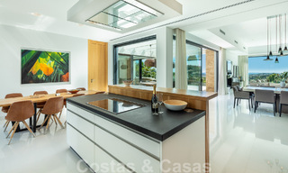 Modern luxury villa for sale located with private tennis court in prestigious residential area in Nueva Andalucia's golf valley, Marbella 50154 
