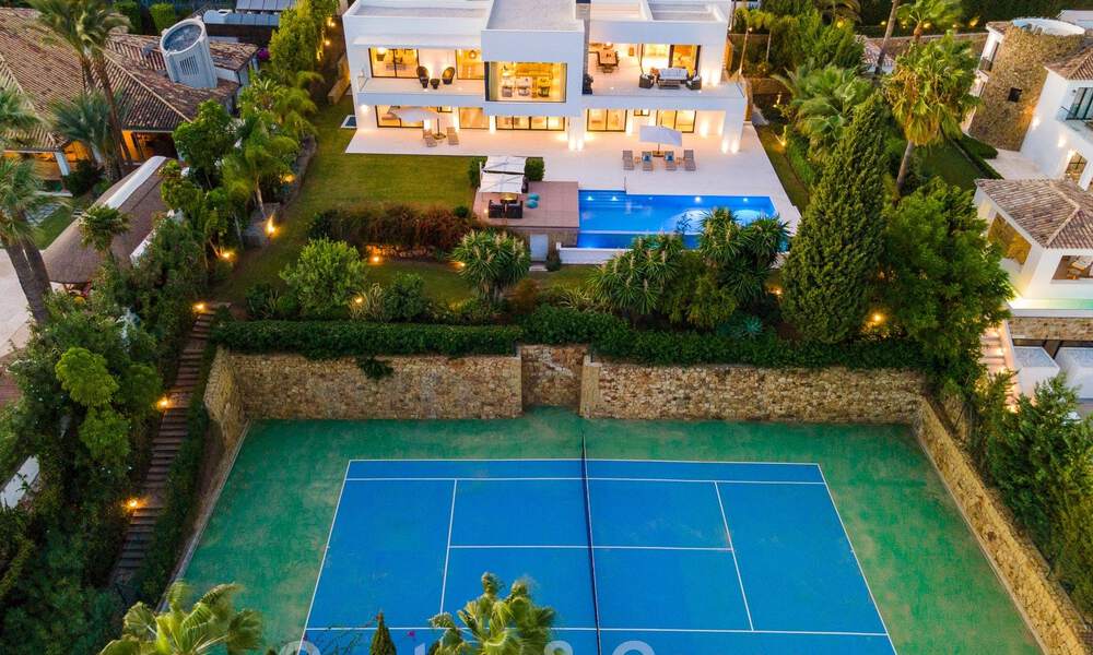 Modern luxury villa for sale located with private tennis court in prestigious residential area in Nueva Andalucia's golf valley, Marbella 50155