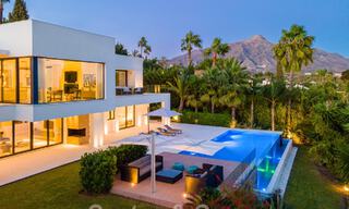 Modern luxury villa for sale located with private tennis court in prestigious residential area in Nueva Andalucia's golf valley, Marbella 50156 