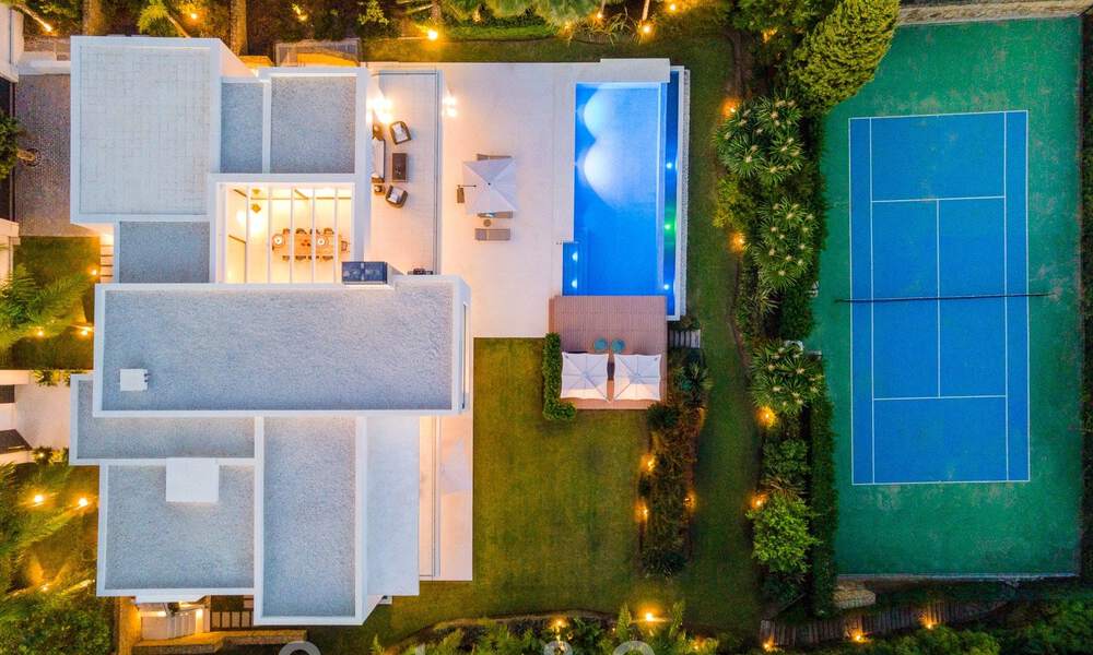 Modern luxury villa for sale located with private tennis court in prestigious residential area in Nueva Andalucia's golf valley, Marbella 50157