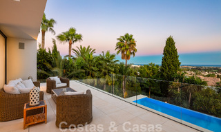 Modern luxury villa for sale located with private tennis court in prestigious residential area in Nueva Andalucia's golf valley, Marbella 50159 