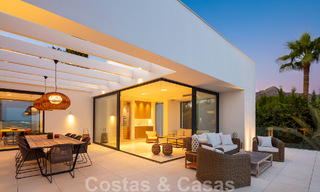 Modern luxury villa for sale located with private tennis court in prestigious residential area in Nueva Andalucia's golf valley, Marbella 50160 