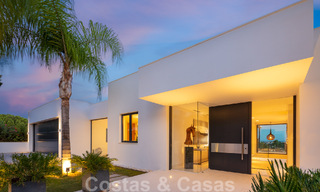 Modern luxury villa for sale located with private tennis court in prestigious residential area in Nueva Andalucia's golf valley, Marbella 50161 