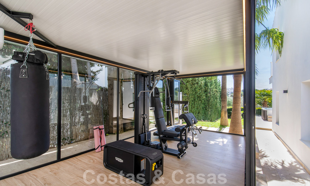 Move-in ready luxury villa for sale adjacent to Las Brisas golf course, in a gated community in Nueva Andalucia's golf valley, Marbella 52080