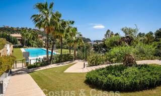 Move-in ready, elevated ground floor apartment for sale with sweeping views of the valley and sea in exclusive Benahavis - Marbella 53307 