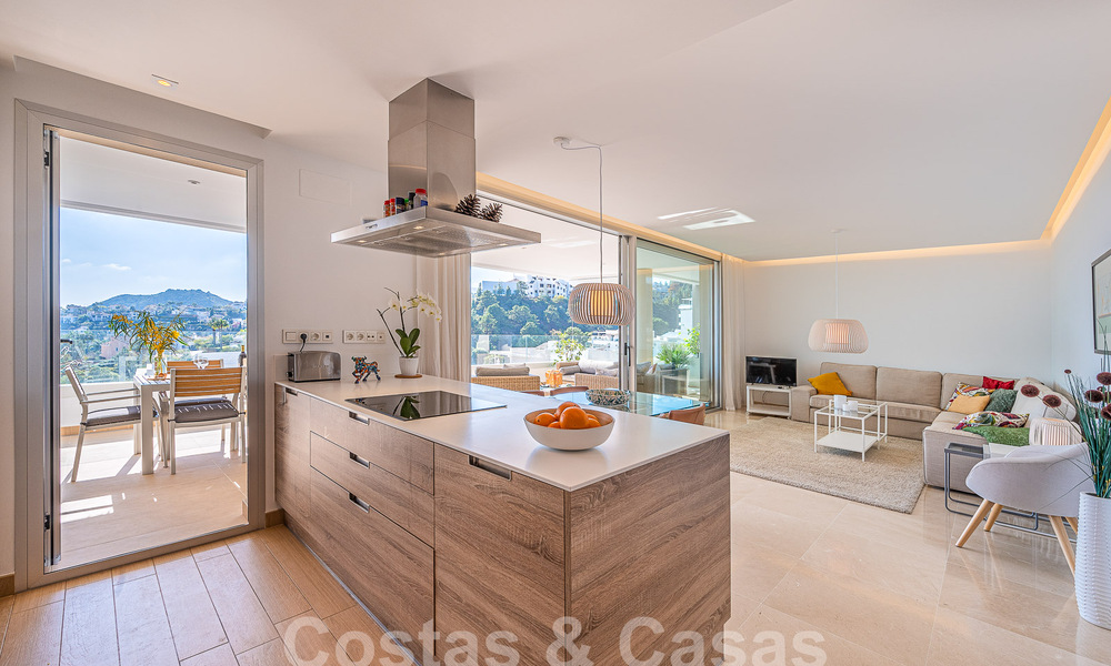 Move-in ready, elevated ground floor apartment for sale with sweeping views of the valley and sea in exclusive Benahavis - Marbella 53317