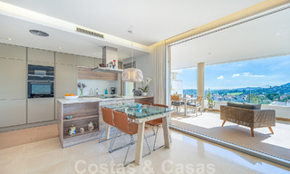 Move-in ready, elevated ground floor apartment for sale with sweeping views of the valley and sea in exclusive Benahavis - Marbella 53318 