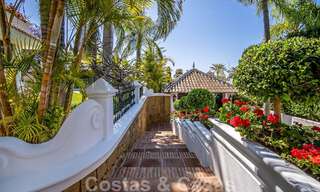 Stylish Andalusian luxury villa for sale a stone's throw from the beach in coveted urbanisation Bahia de Marbella 51877 
