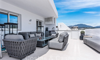 Contemporary renovated penthouse for sale with mountain and sea views in Nueva Andalucia, Marbella 53594 