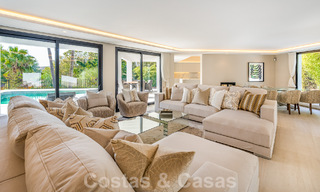 Spacious luxury villa for sale with a traditional architectural style located in a preferred residential area on the New Golden Mile, Marbella - Benahavis 55007 