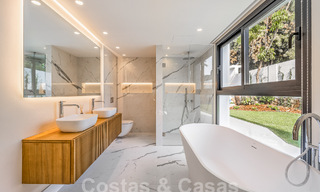 Spacious luxury villa for sale with a traditional architectural style located in a preferred residential area on the New Golden Mile, Marbella - Benahavis 55011 