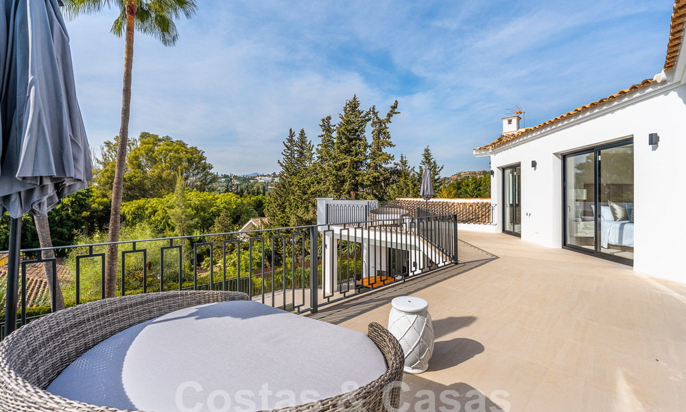 Spacious luxury villa for sale with a traditional architectural style located in a preferred residential area on the New Golden Mile, Marbella - Benahavis 55015