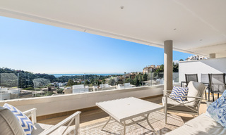 Move-in ready apartment for sale with sweeping views of the valley and sea in exclusive Marbella – Benahavis 55021 
