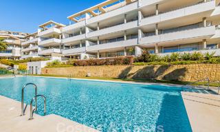 Move-in ready apartment for sale with sweeping views of the valley and sea in exclusive Marbella – Benahavis 55033 