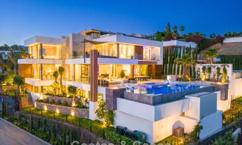 Stunning, architectural luxury villa for sale with open sea views in an elevated gated residential area in the hills of La Quinta in Marbella - Benahavis 54120