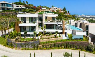 Stunning, architectural luxury villa for sale with open sea views in an elevated gated residential area in the hills of La Quinta in Marbella - Benahavis 54125 