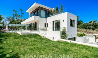 Spacious contemporary luxury villa located on frontline golf with views of La Concha mountain in Nueva Andalucia, Marbella 55558 