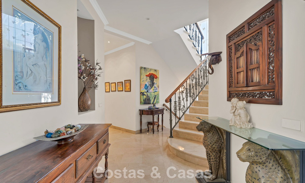 Stately luxury Andalusian-style mansion with sea views in Nueva Andalucia's golf valley, Marbella 779158