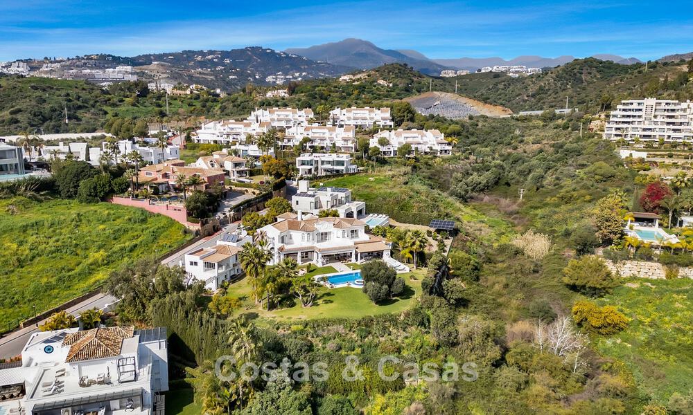 Stately luxury Andalusian-style mansion with sea views in Nueva Andalucia's golf valley, Marbella 779181
