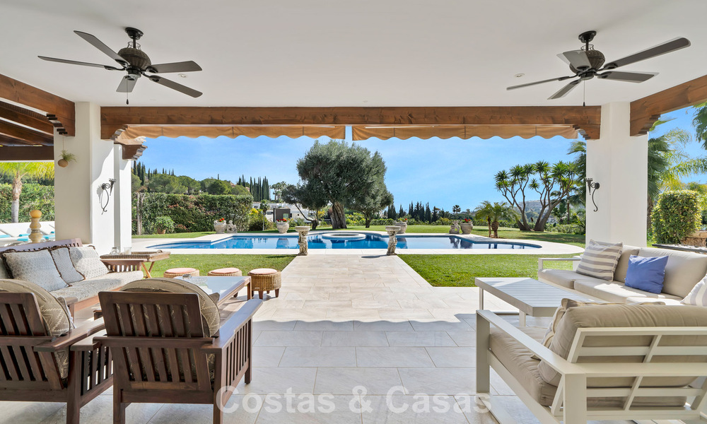 Stately luxury Andalusian-style mansion with sea views in Nueva Andalucia's golf valley, Marbella 779199