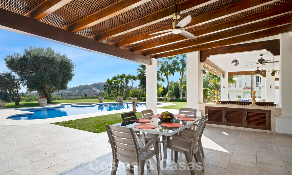 Stately luxury Andalusian-style mansion with sea views in Nueva Andalucia's golf valley, Marbella 779210