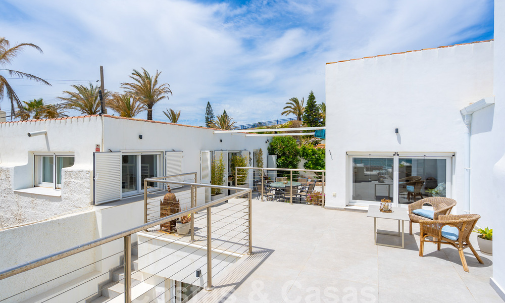 Mediterranean villa for sale with contemporary interior and frontal sea views in gated beachside urbanisation of Estepona 55799
